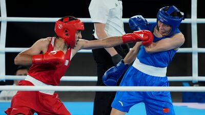 Algeria's Imane Khelif, left, fights China's Yang Liu. AP