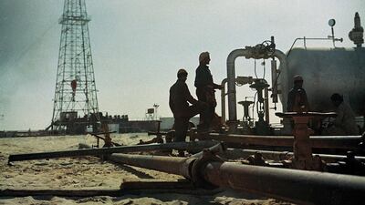 The Murban 2 oil well in Abu Dhabi, pictured in 1956. The discovery of oil transformed the emirate and eventually the UAE. Three oil derricks are featured on the 50 fils coin. Adnoc