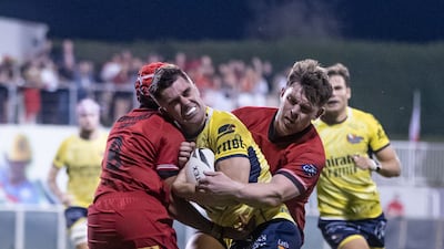 James Coulton of Dubai Hurricanes carries the ball against Bahrain.