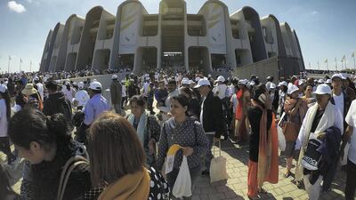 Worshippers leave the stadium at Zayed Sports City, Abu Dhabi, after Pope Francis led a holy Mass there in 2019. The building opened in 1979 and is featured on the Dh200 banknote. Pawan Singh / The National