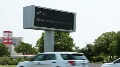 Electronic traffic signs on E311 highway, which is being used to advertise the new Salik IPO scheme in Dubai. Pawan Singh / The National