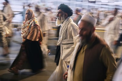 Pilgrims leave evening prayers outside the Grand Mosque. AP